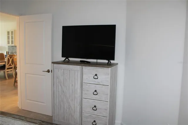 a living room with furniture and a lamp