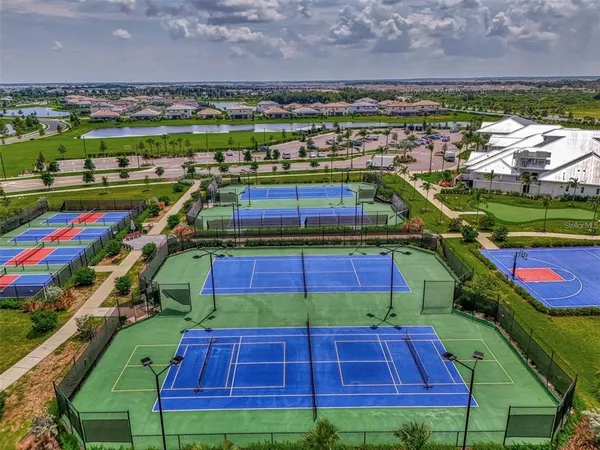 a view of yard with swimming pool and green space