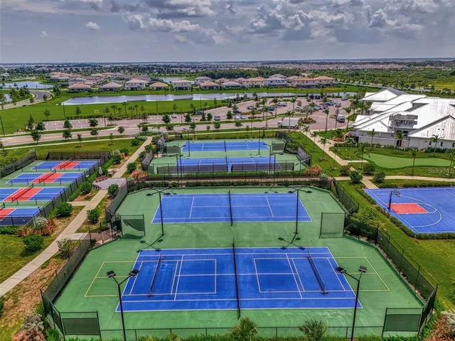 a view of yard with swimming pool and green space