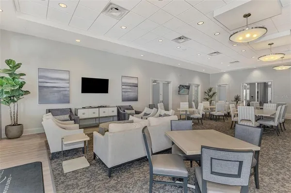 a view of a dining area with furniture and wooden floor