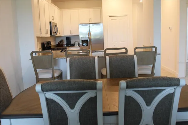 a living room with furniture or couch and a potted plant