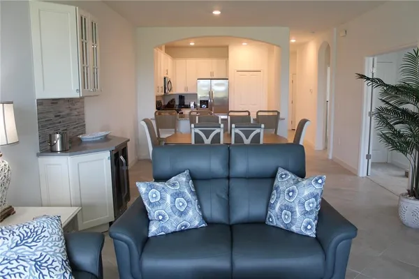 a living room with furniture and a lamp