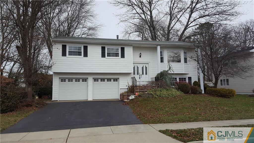 9 Gramercy Road Old Bridge, NJ 08857 - Photo 1 of 7 a front view of a house with garden