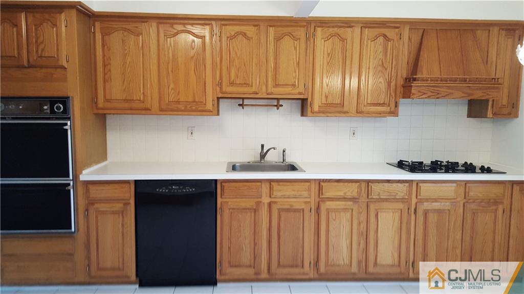 9 Gramercy Road Old Bridge, NJ 08857 - Photo 4 of 7 a kitchen with stainless steel appliances granite countertop a refrigerator and sink