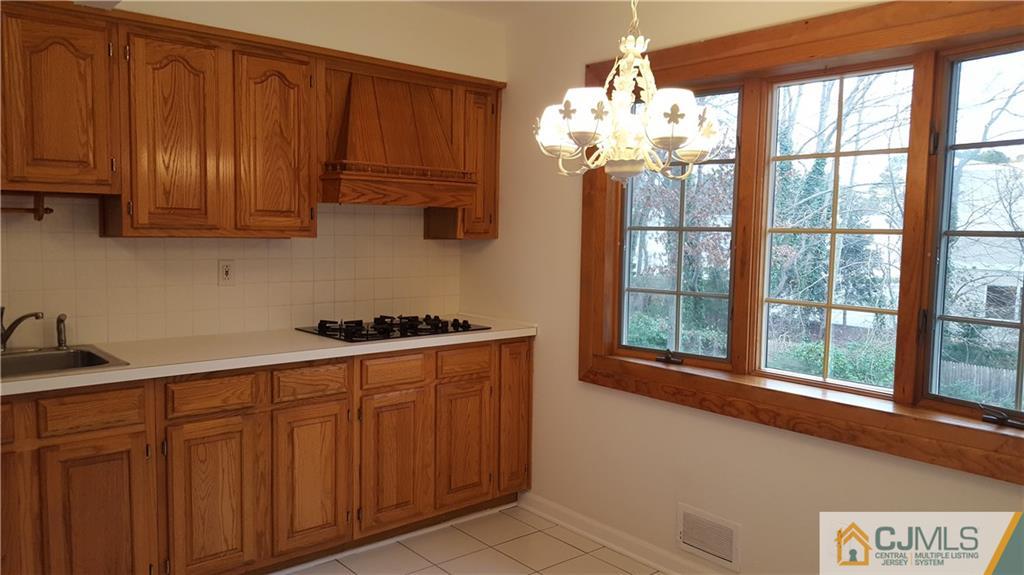 9 Gramercy Road Old Bridge, NJ 08857 - Photo 5 of 7 a kitchen with stainless steel appliances granite countertop a refrigerator and a sink