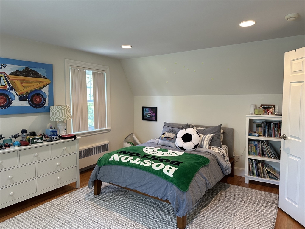 45 Wellesley Road Belmont, MA 02478 - Photo 25 of 42 a bedroom with a bed and a cabinets