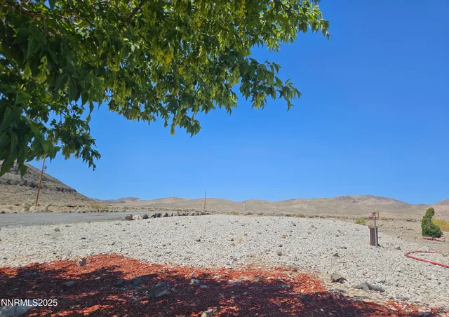 a view of an empty room with a ocean