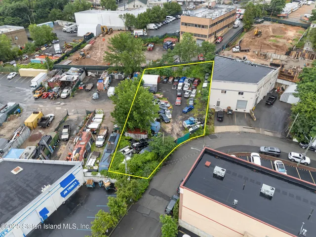 an aerial view of a house with a garden