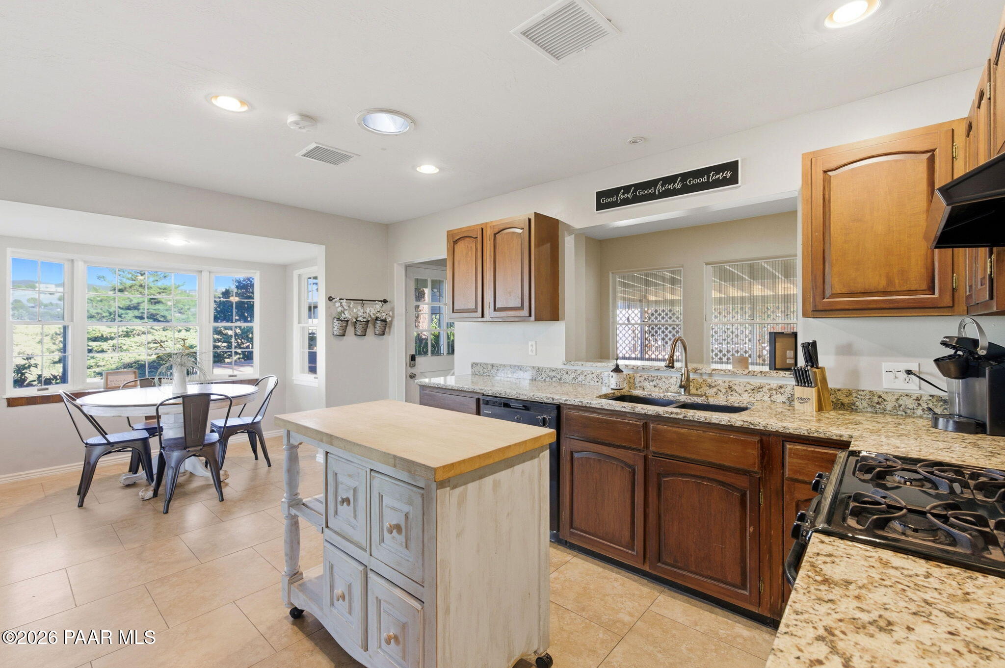 803 East Carleton Street Prescott, AZ 86303 - Photo 11 of 43 a kitchen with a sink stove and wooden cabinets