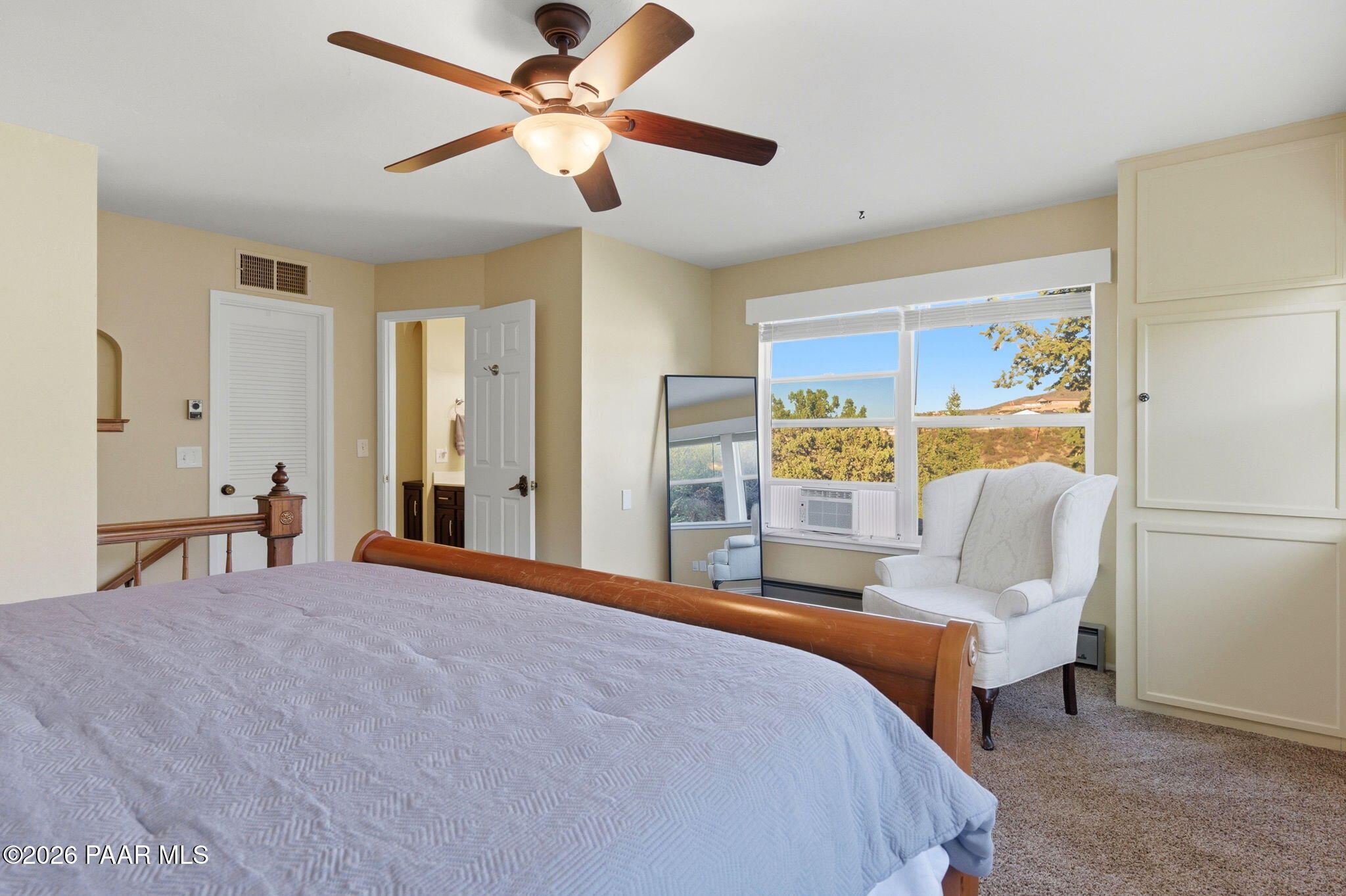 803 East Carleton Street Prescott, AZ 86303 - Photo 14 of 43 a bedroom with a bed ceiling fan and a window