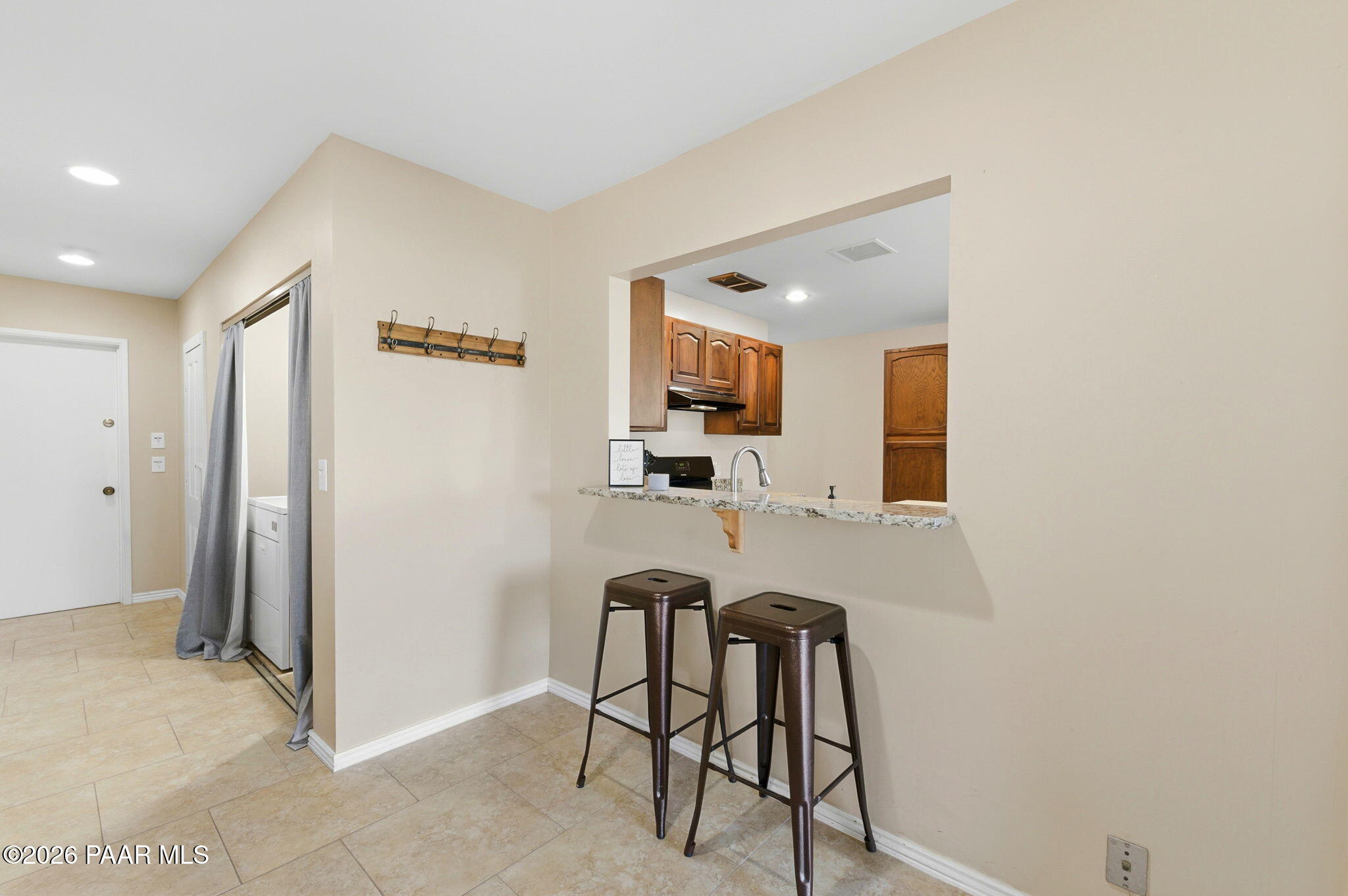 803 East Carleton Street Prescott, AZ 86303 - Photo 18 of 43 a view of a kitchen with kitchen island cabinets and stainless steel appliances