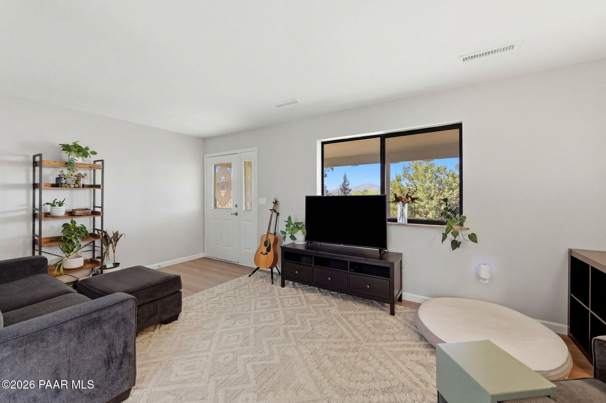 803 East Carleton Street Prescott, AZ 86303 - Photo 34 of 43 a living room with furniture and a flat screen tv