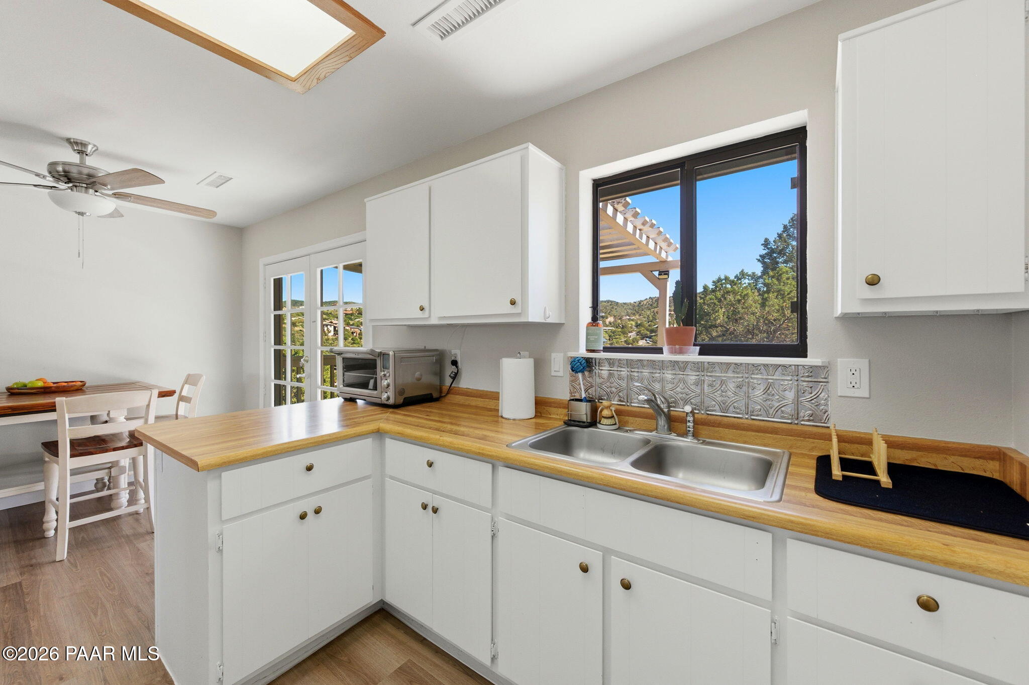 803 East Carleton Street Prescott, AZ 86303 - Photo 35 of 43 a kitchen with a sink cabinets and window