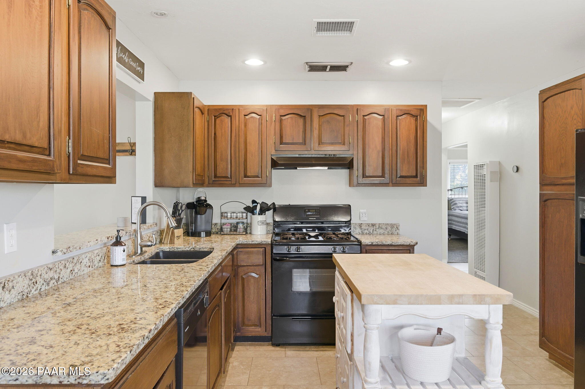 803 East Carleton Street Prescott, AZ 86303 - Photo 9 of 43 a kitchen with stainless steel appliances granite countertop a sink stove and refrigerator