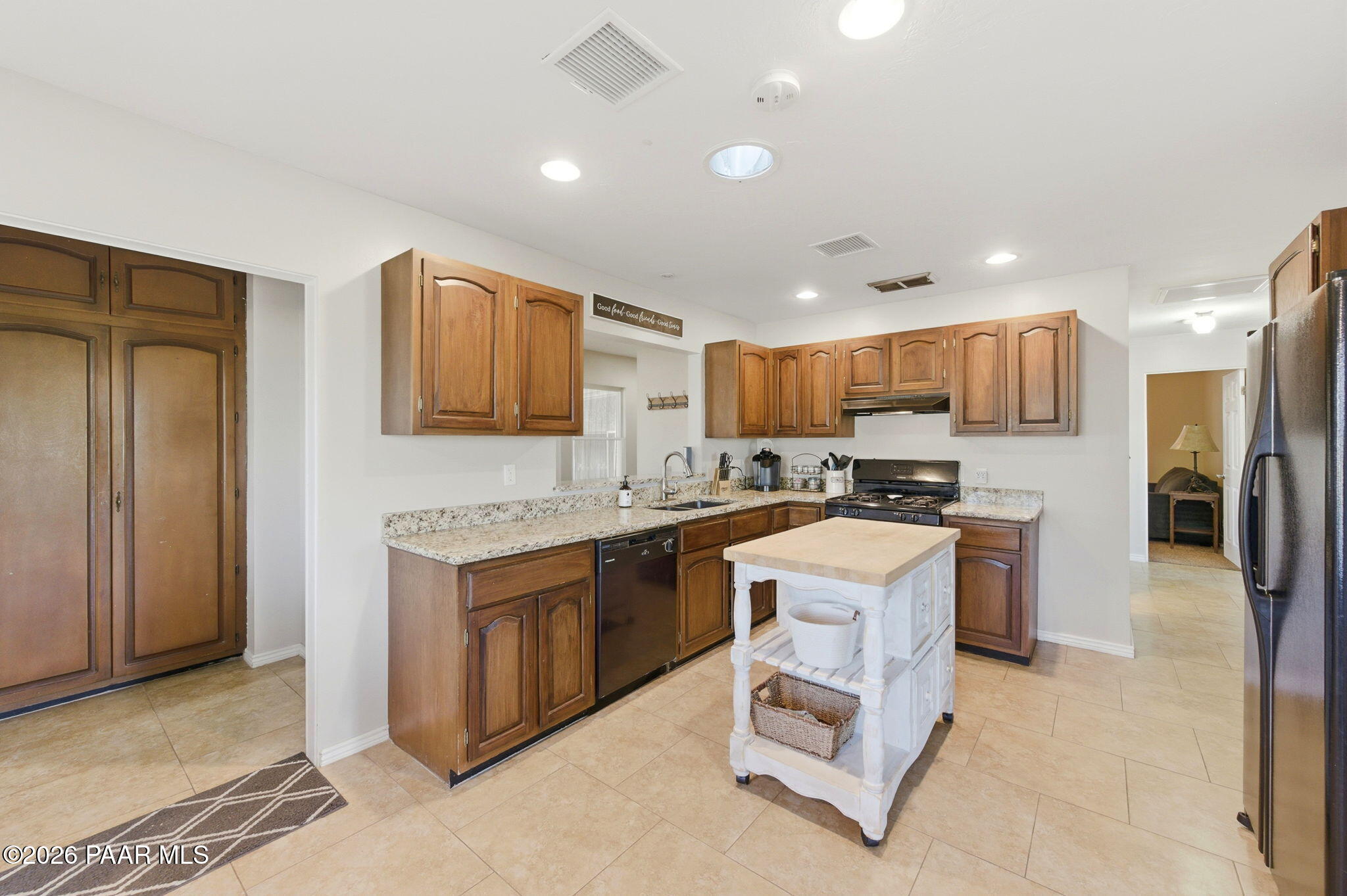 803 East Carleton Street Prescott, AZ 86303 - Photo 10 of 43 a kitchen with a sink cabinets and refrigerator