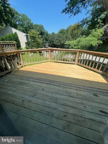 a view of balcony with wooden floor and outdoor space