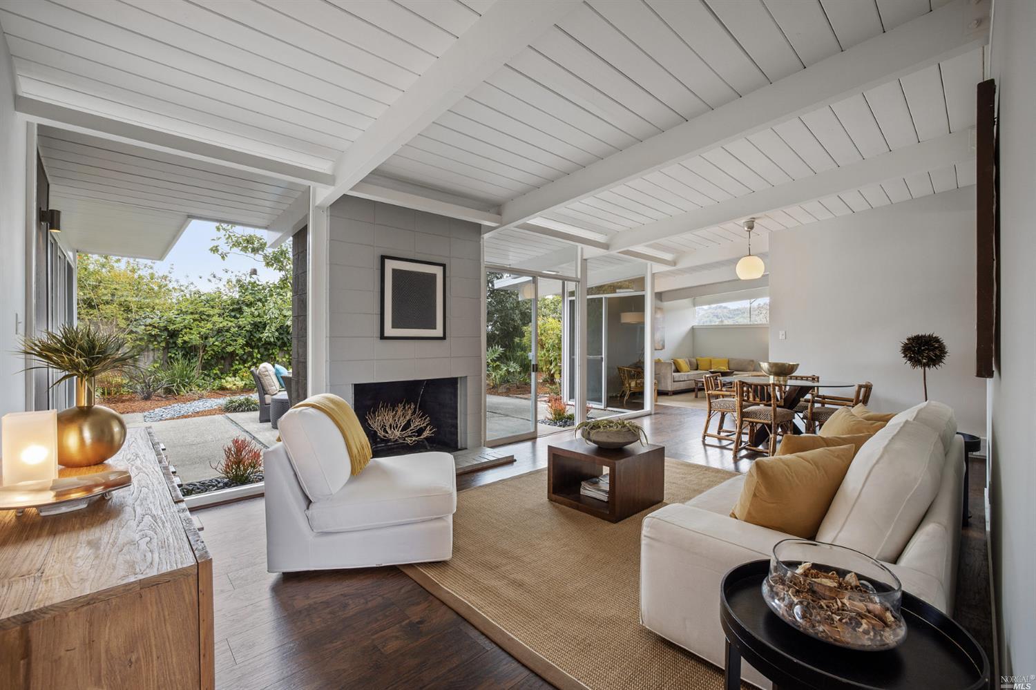 770 Las Colindas Road San Rafael, CA 94903 - Photo 1 of 1 a living room with furniture fireplace and a large window