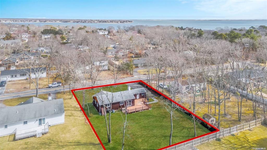 168 West Tiana Road Hampton Bays, NY 11946 - Photo 15 of 17 a view of swimming pool with a yard from a balcony