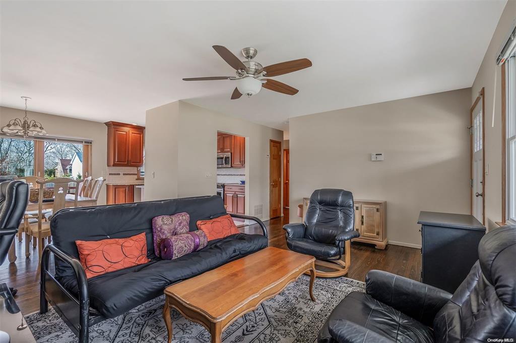 168 West Tiana Road Hampton Bays, NY 11946 - Photo 3 of 17 a living room with furniture
