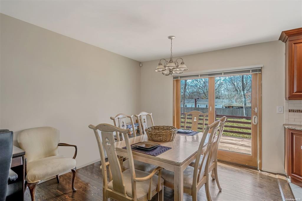 168 West Tiana Road Hampton Bays, NY 11946 - Photo 5 of 17 a view of a dining room with furniture window and outside view