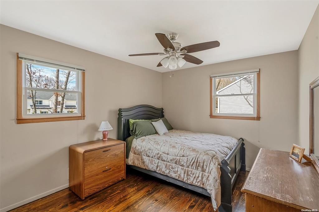 168 West Tiana Road Hampton Bays, NY 11946 - Photo 8 of 17 a bedroom with a bed and a window