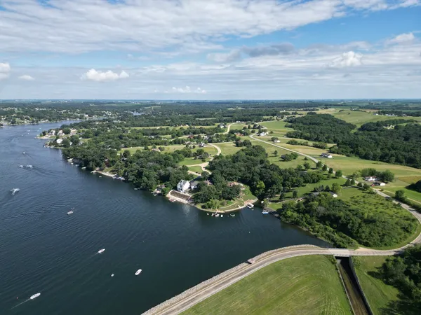 an aerial view of a golf course with houses