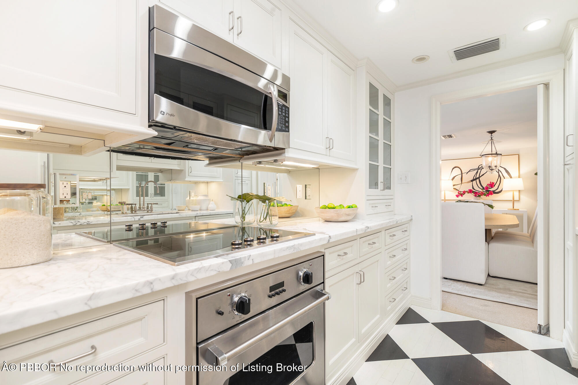 330 Cocoanut Row, Unit 12 Palm Beach, FL 33480 - Photo 13 of 18 a kitchen with stainless steel appliances granite countertop a sink and a stove