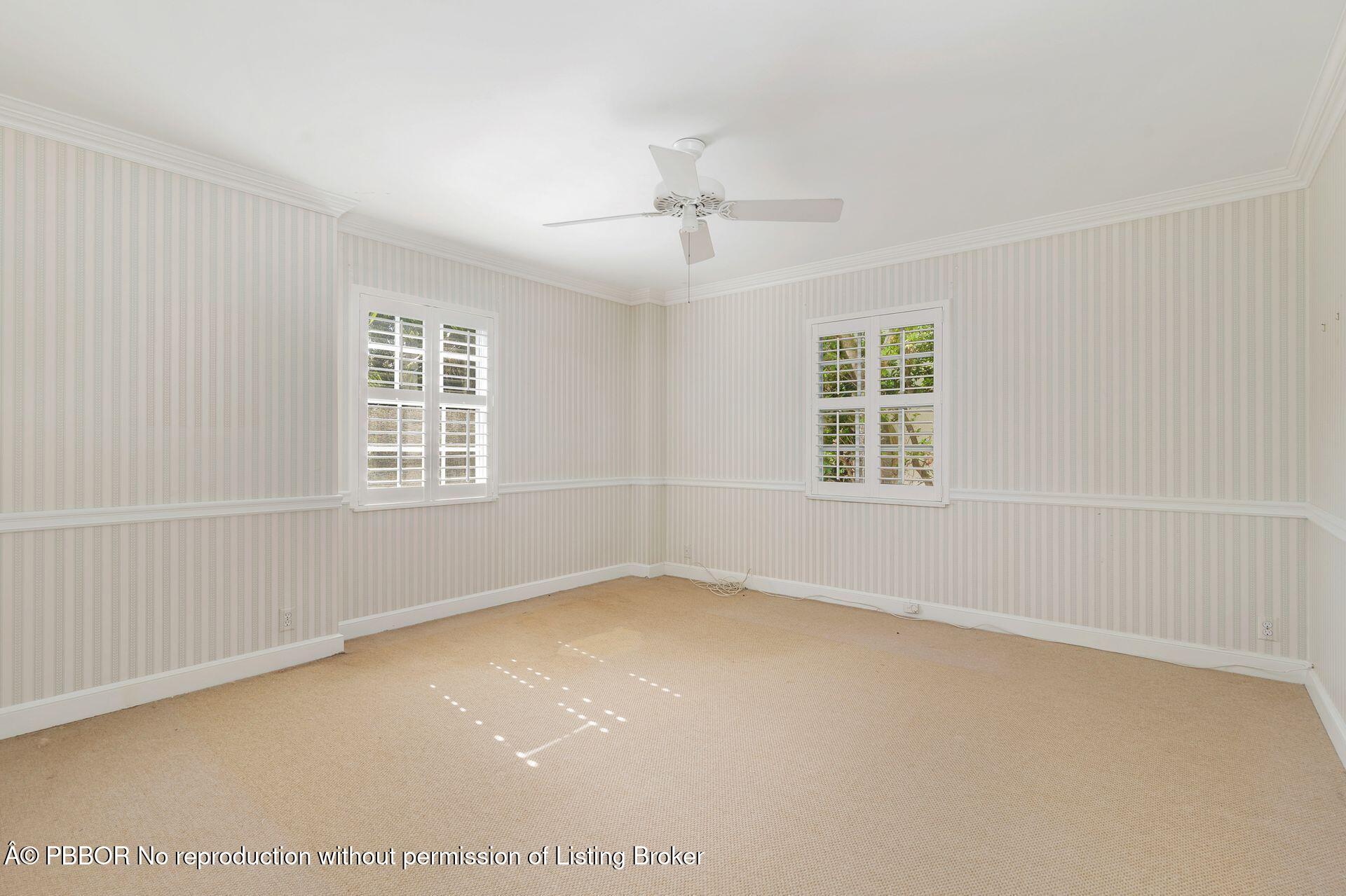 330 Cocoanut Row, Unit 12 Palm Beach, FL 33480 - Photo 13 of 19 an empty room with windows