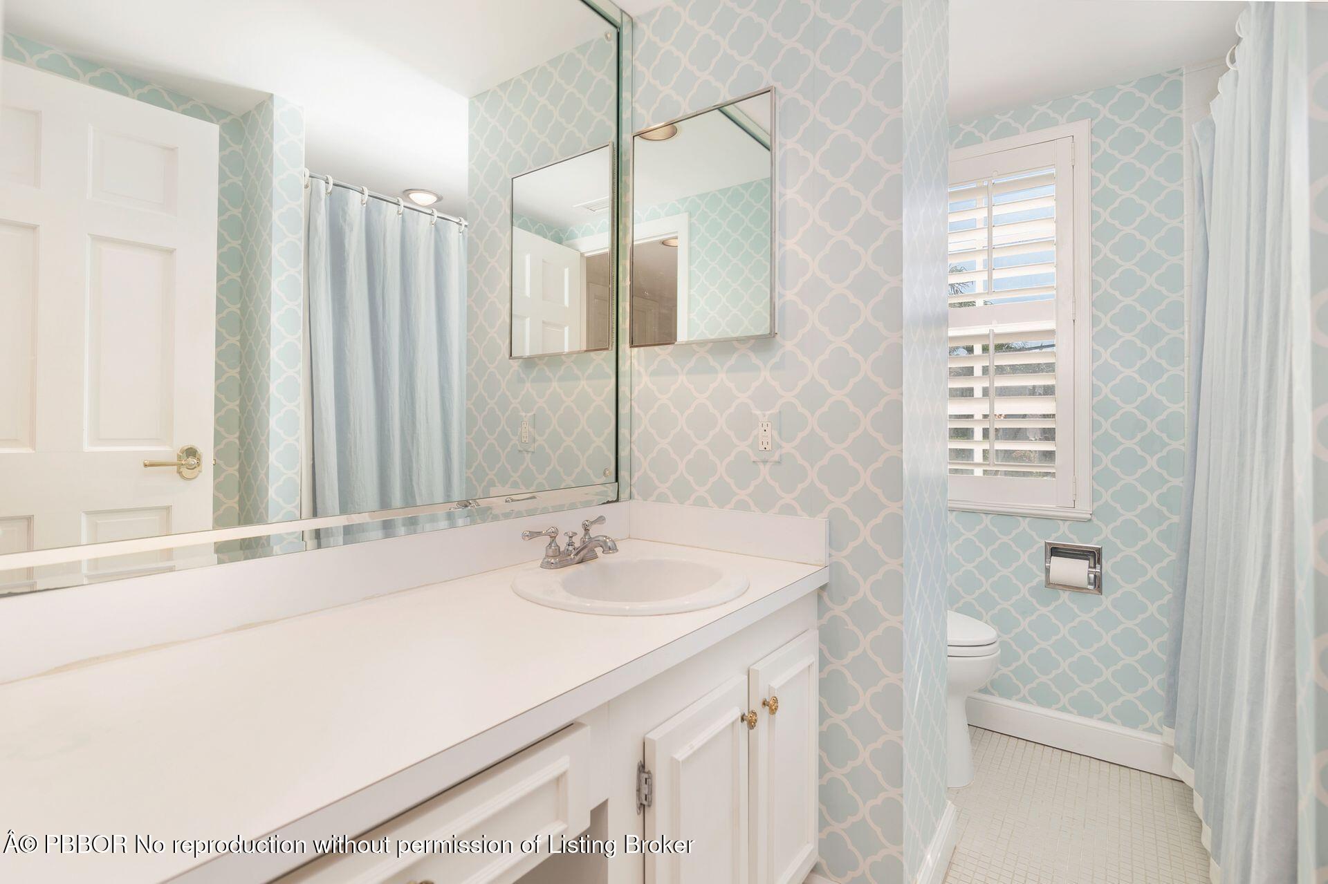 330 Cocoanut Row, Unit 12 Palm Beach, FL 33480 - Photo 15 of 19 a bathroom with a sink and a mirror