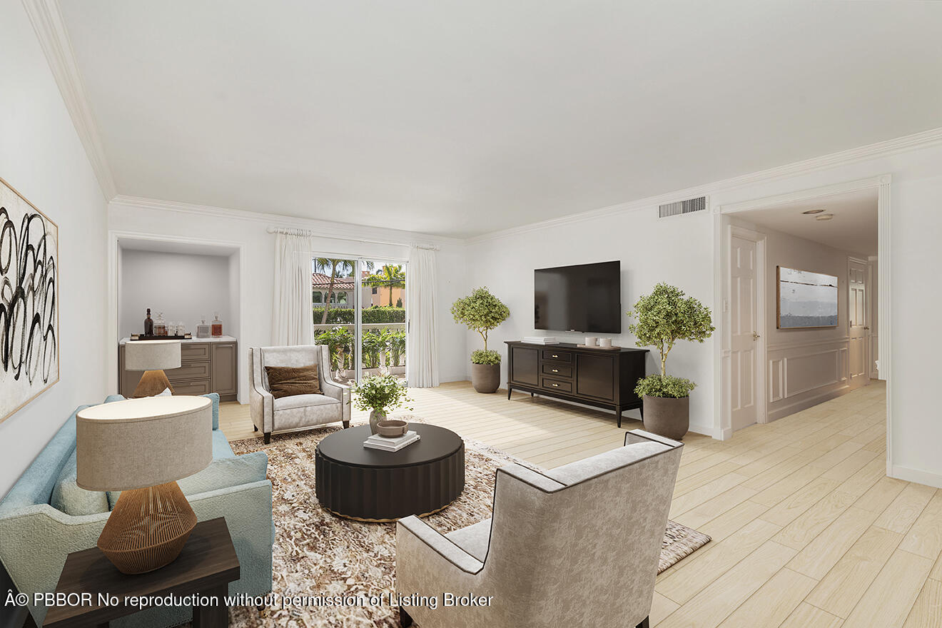 330 Cocoanut Row, Unit 12 Palm Beach, FL 33480 - Photo 5 of 19 a living room with furniture a flat screen tv and a fireplace