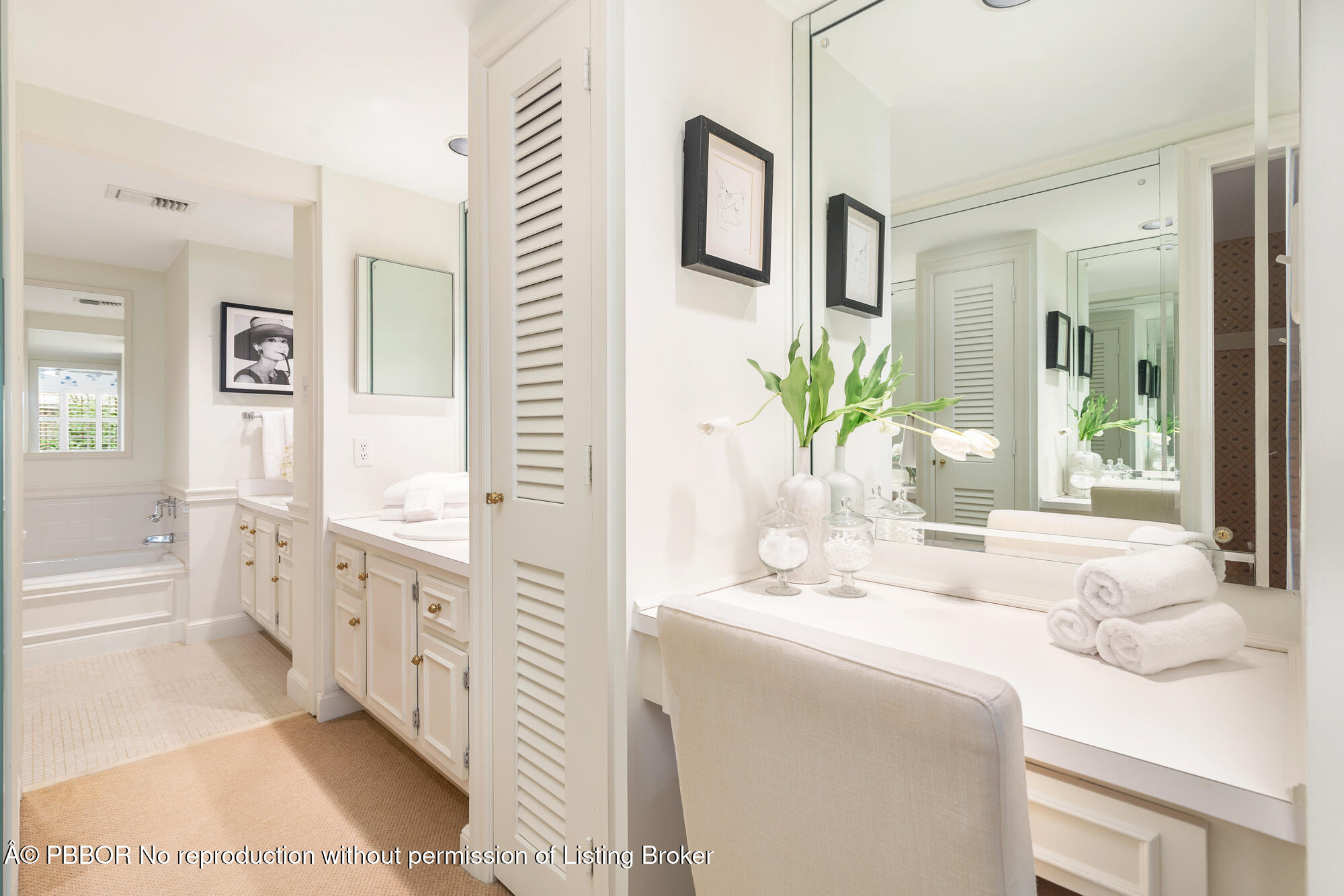 330 Cocoanut Row, Unit 12 Palm Beach, FL 33480 - Photo 10 of 18 a bathroom with a granite countertop sink a large mirror a bathtub and next to a window
