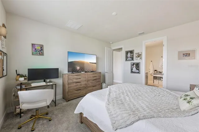 a bedroom with a workspace