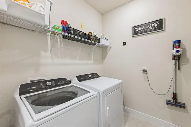 a utility room with dryer and washer