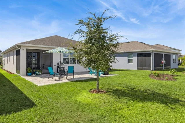a front view of a house with a yard and porch