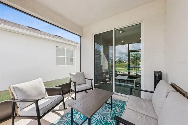 a living room with furniture and a window