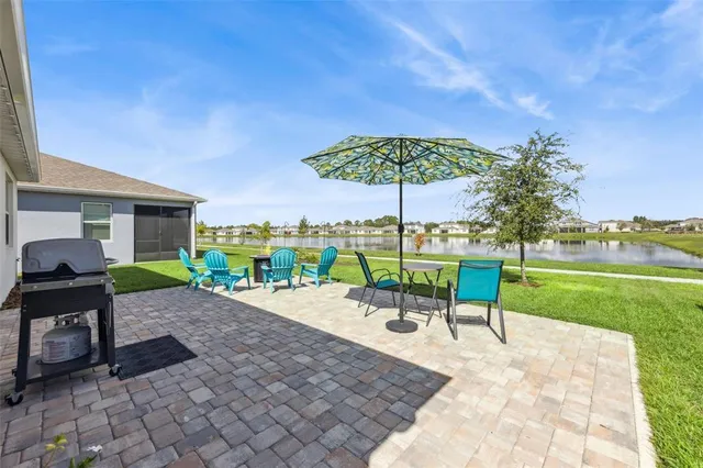 a view of a backyard with a garden and patio