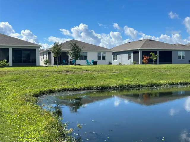 a front view of a house with a garden and a yard