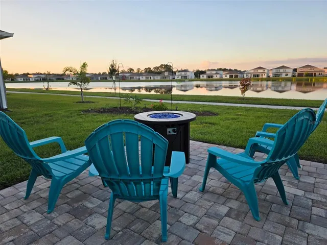 a building view with swimming pool and garden space