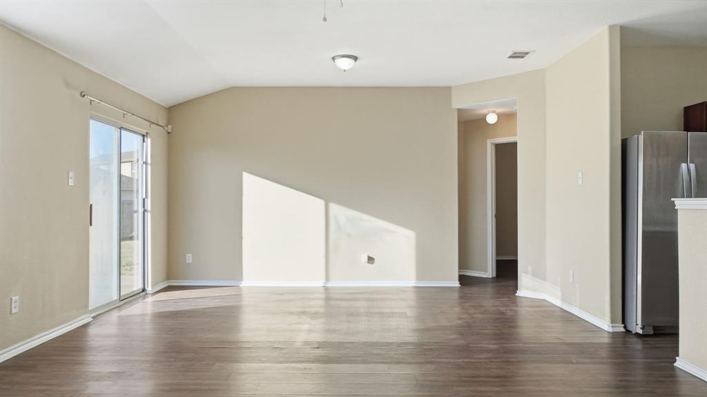 101 Long Prairie Drive Forney, TX 75126 - Photo 13 of 40 a view of an empty room with wooden floor and closet