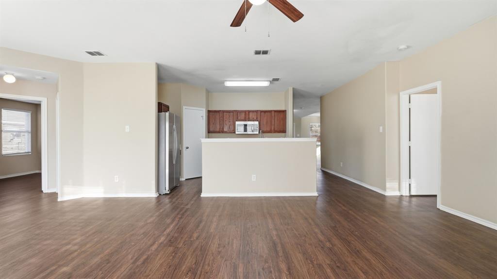 101 Long Prairie Drive Forney, TX 75126 - Photo 14 of 40 a view of a room with wooden floor and window