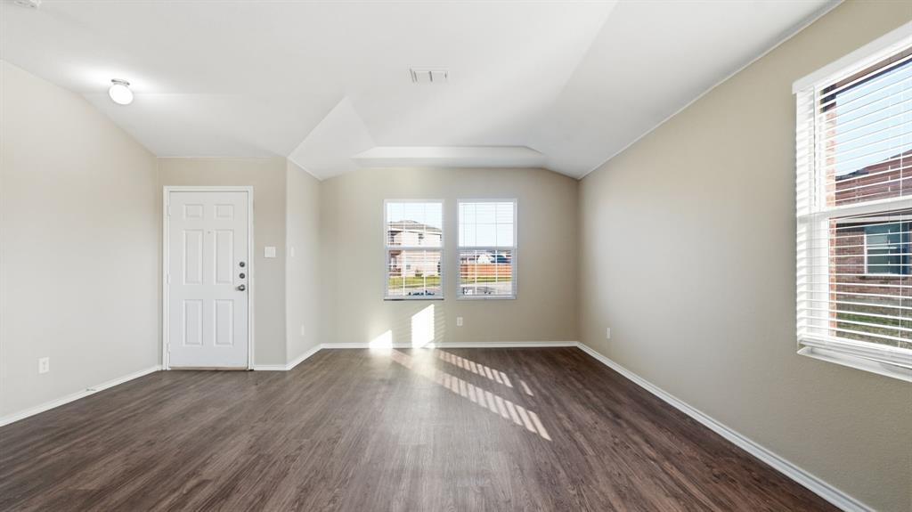 101 Long Prairie Drive Forney, TX 75126 - Photo 18 of 40 wooden floor in an empty room with a window