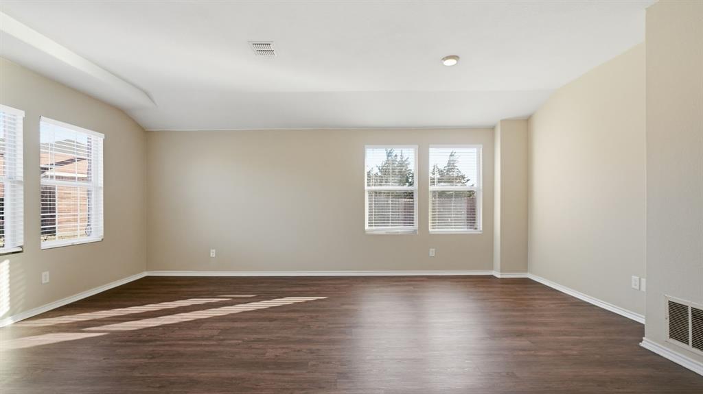 101 Long Prairie Drive Forney, TX 75126 - Photo 20 of 40 a view of wooden floor and windows in a room