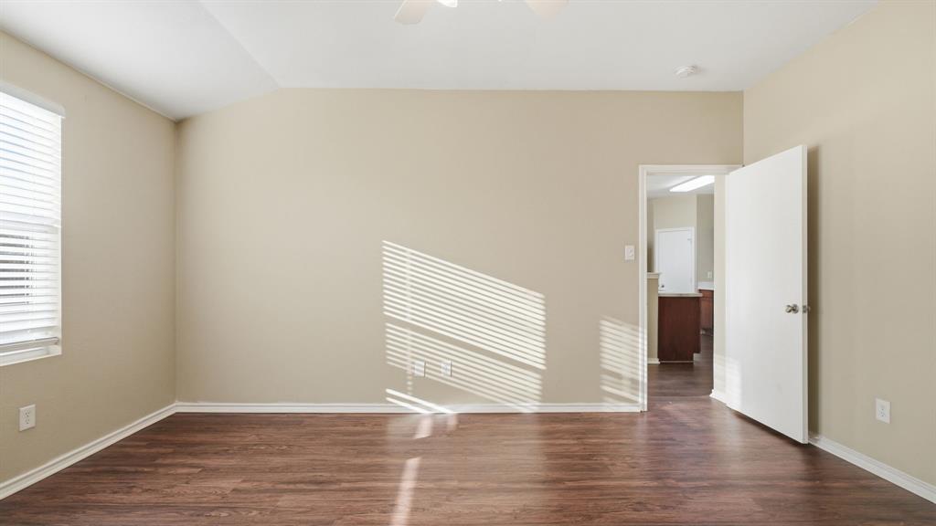 101 Long Prairie Drive Forney, TX 75126 - Photo 25 of 40 an empty room with wooden floor and windows
