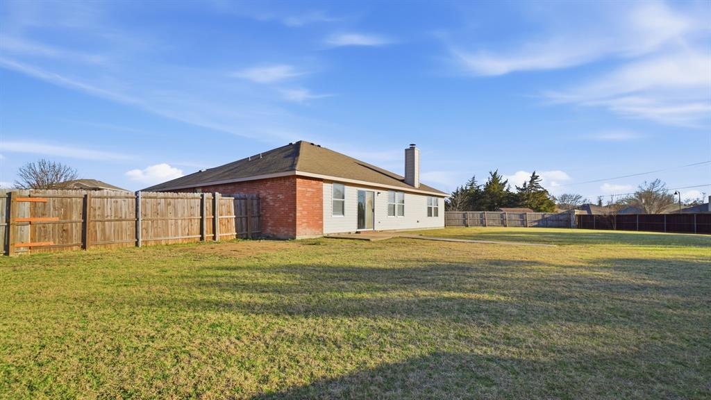 101 Long Prairie Drive Forney, TX 75126 - Photo 37 of 40 a big house with a big yard and large trees