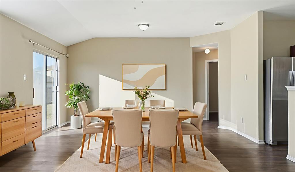 101 Long Prairie Drive Forney, TX 75126 - Photo 4 of 40 a view of a dining room with furniture and wooden floor