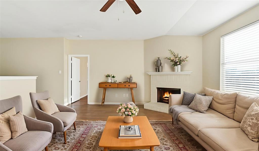101 Long Prairie Drive Forney, TX 75126 - Photo 5 of 40 a living room with furniture a fireplace and window