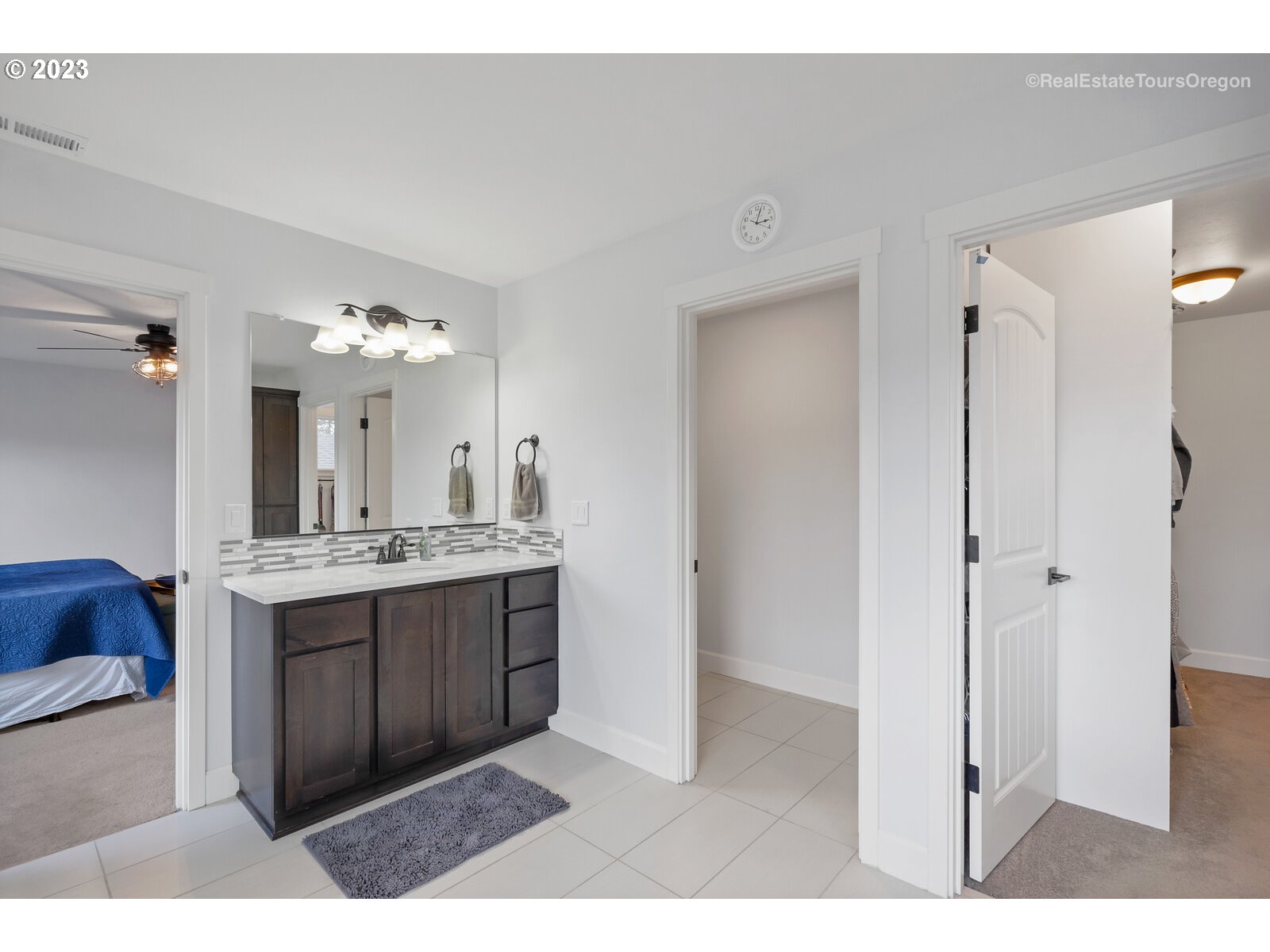 4584 North 9th Street Ridgefield, WA 98642 - Photo 21 of 39 a bathroom with a double vanity sink mirror and shower