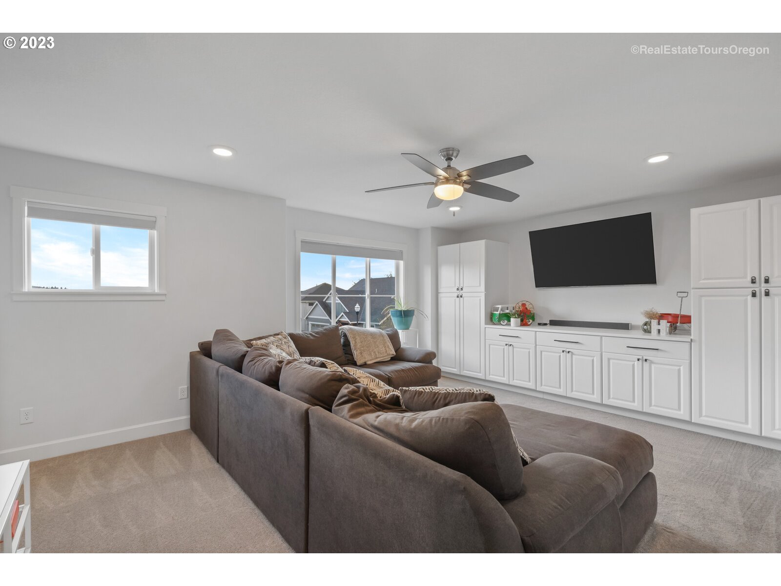 4584 North 9th Street Ridgefield, WA 98642 - Photo 22 of 39 a living room with furniture and a flat screen tv