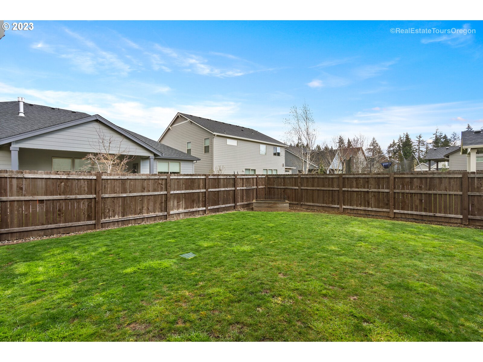 4584 North 9th Street Ridgefield, WA 98642 - Photo 39 of 39 a view of a yard with a wooden fence