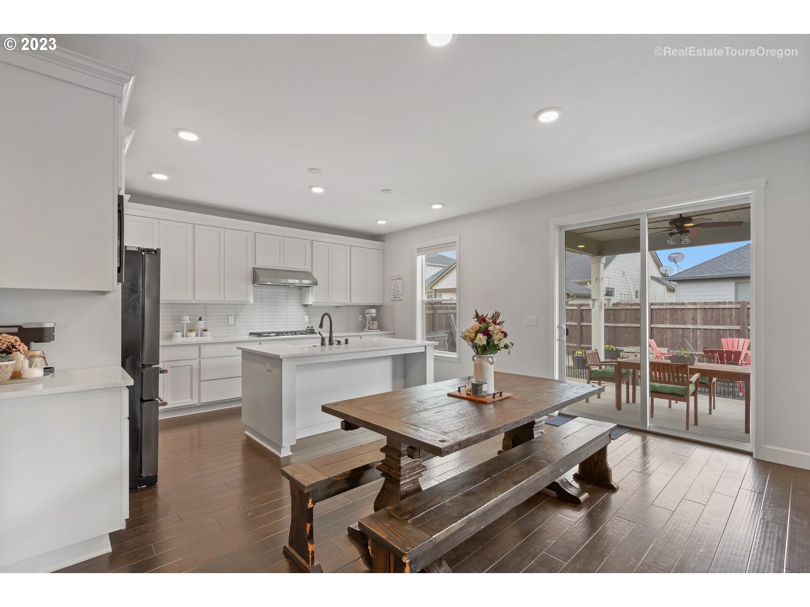 4584 North 9th Street Ridgefield, WA 98642 - Photo 6 of 39 a living room with stainless steel appliances kitchen island granite countertop furniture and wooden floor